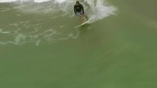 Surfers ride the big waves from Hurricane Sandy in Florida [upl. by Lodhia]