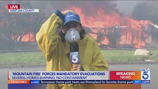 Homes go up in flames during reporters live shot [upl. by Sivahc]