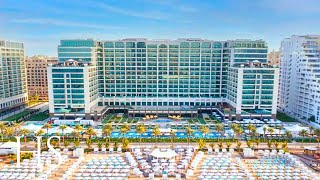 HILTON Dubai Palm Jumeirah Hotel  BEACHFRONT Resort full tour 4K [upl. by Ayaet]