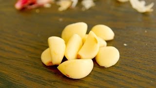 How to peel garlic in seconds so easy 10 second garlic peel [upl. by Kermit783]